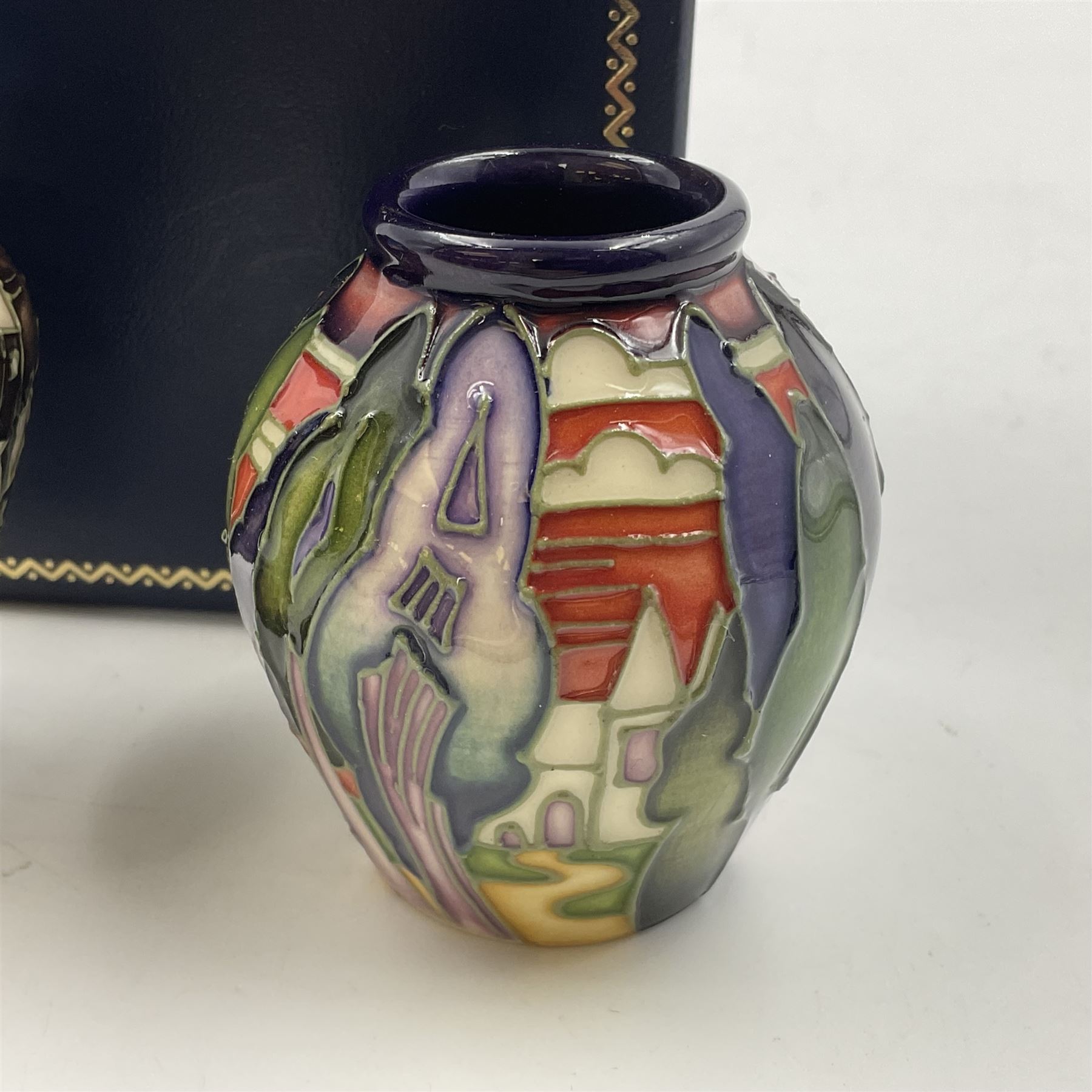 Two miniature Moorcroft vases, one decorated in the Lodge Hill pattern, circa 2007, H6cm,  and the other decorated in Made in Burslem circa 2011, H6cm  