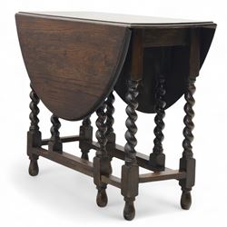 20th century oak gateleg table, with oval fold-out top supported on turned barley twist legs and stretchers (Extended 116cm)