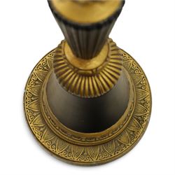 Neoclassical design table lamp, black painted and gilt metal column with fluted central section, foliate and stiff leaf cast decoration, on circular spreading base, fitted with shade frame