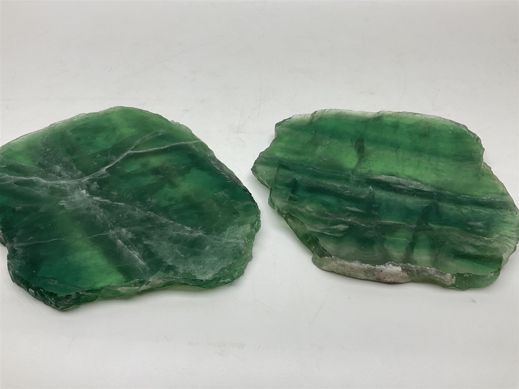 Pair of green fluorite slices, polished with rough edges, H16cm, L17cm  