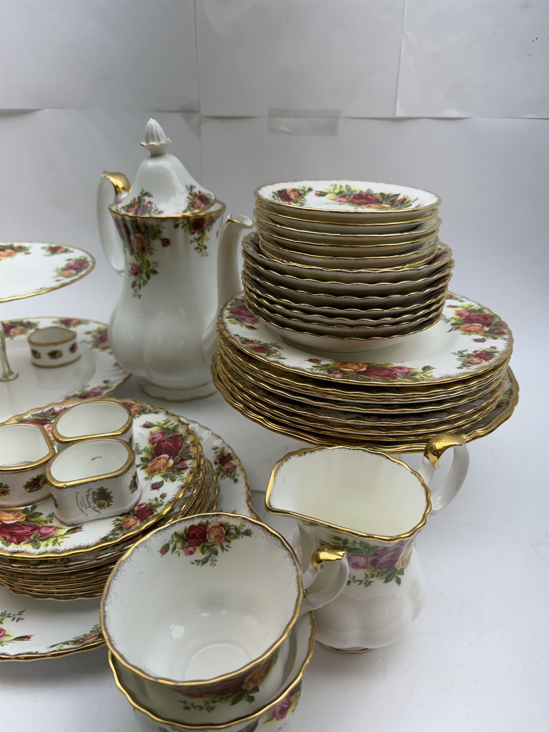 Royal Albert Old Country Roses pattern tea wares, comprising coffee pot, jug and sugar bowl, cake stands, napkin rings, teacups and saucers, side plates, dessert plates, small plates, all with printed marks beneath