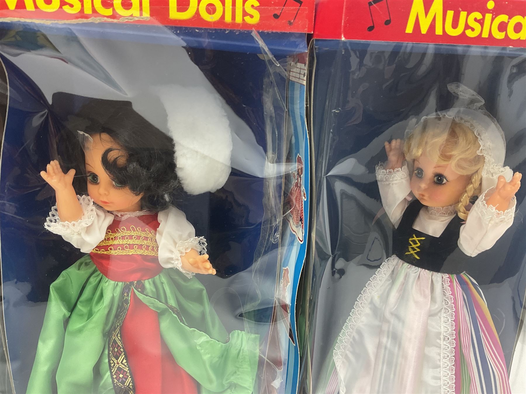 Four Mayfair Products Musical Dolls of Many Lands; original boxes and delivery boxes; and set of twelve Nationality Dolls with Sleeping Eyes; boxed (16)