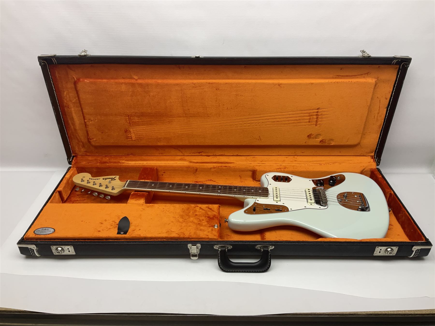 Fender Jaguar electric guitar, American Custom Shop vintage re-issue, probably in seafoam green, with tremolo arm, serial no.V1317106, L101cm; in American G&G Fender fitted hard case with paperwork