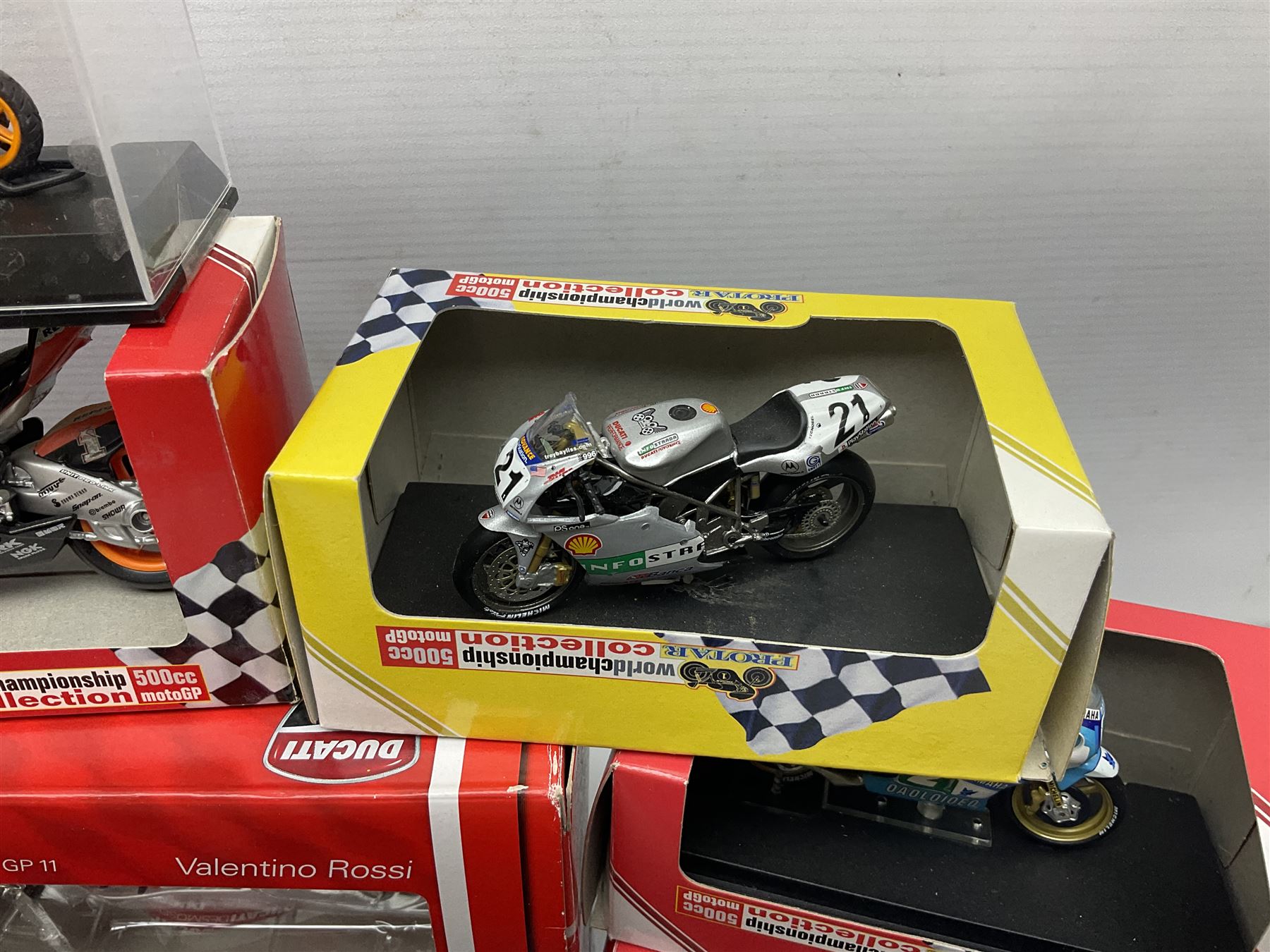 Fifty-one die-cast models of motorcycles by Maisto, Protar Italeri, Welly etc; many in perspex display boxes, some in window boxes and some unboxed
