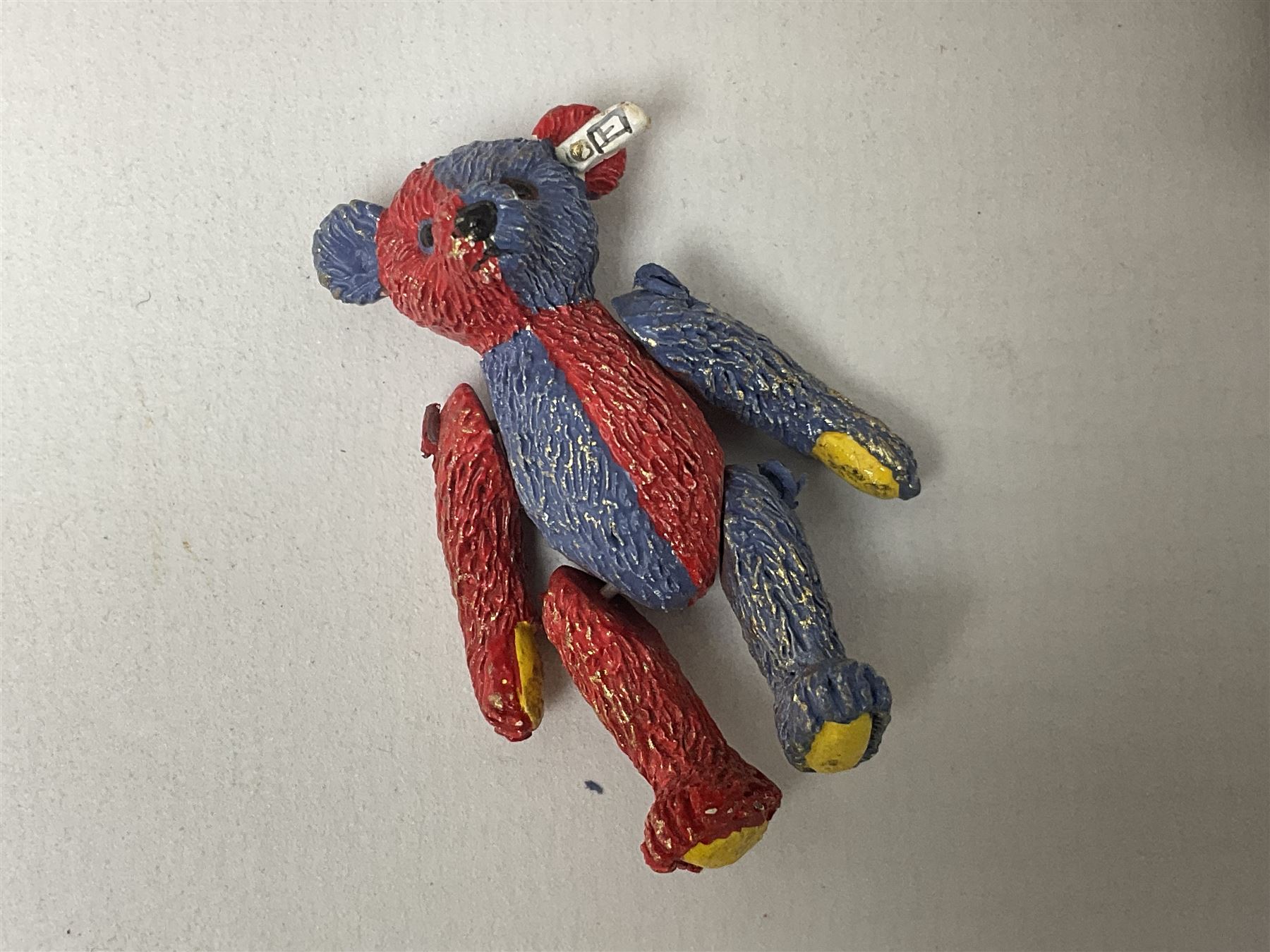 Group of Steiff figures, comprising Mikki and Mukki, circa 1950s no 7628/12 and 7627/12, with original tags, two hedgehogs no 1570/10, and another smaller 1670/03, small owl no 7480/06, and painted metal Steiff harlequin style bear