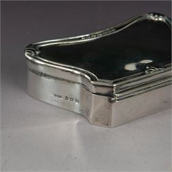 Early 20th century silver mounted jewellery box, with curved front and embossed palmette rim, opening to revel padded interior with weighted base, hallmarked A & J Zimmerman Ltd, Birmingham 1911, H3cm, W11cm