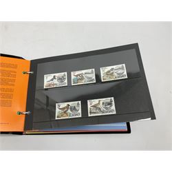Great British, Channel Islands and World stamps, including used Queen Victoria and later stamps on stockcards and loose in containers, Guernsey mint stamps on cards, Jersey, Guernsey, Alderney and Isle of Man mint and used stamps in a stockbook, various first day covers etc and approximately 55 GBP face value of Queen Elizabeth II mint usable postage in presentation packs, in one box