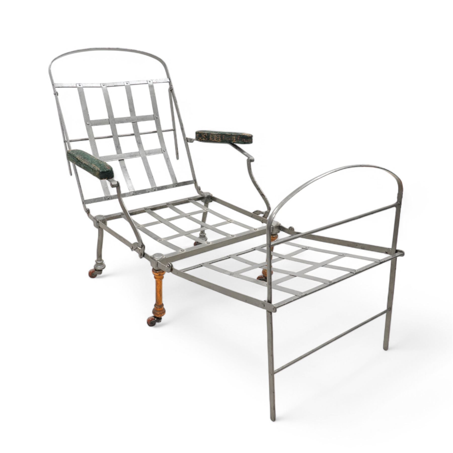 Victorian foldable day bed, button back padded arms, reupholstered in a green fabric with Latin script, turned feet with ceramic castors