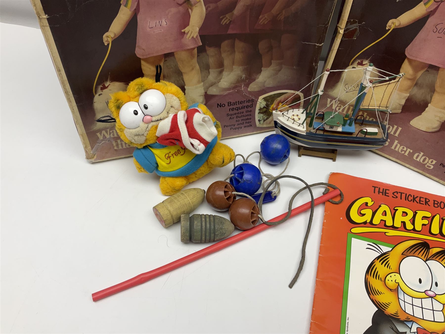 Two boxed Bradgate Penny Puppywalker dolls; Garfield soft toy and Panini sticker album; boxed Stylophone with instructional 45rpm record; and other toys