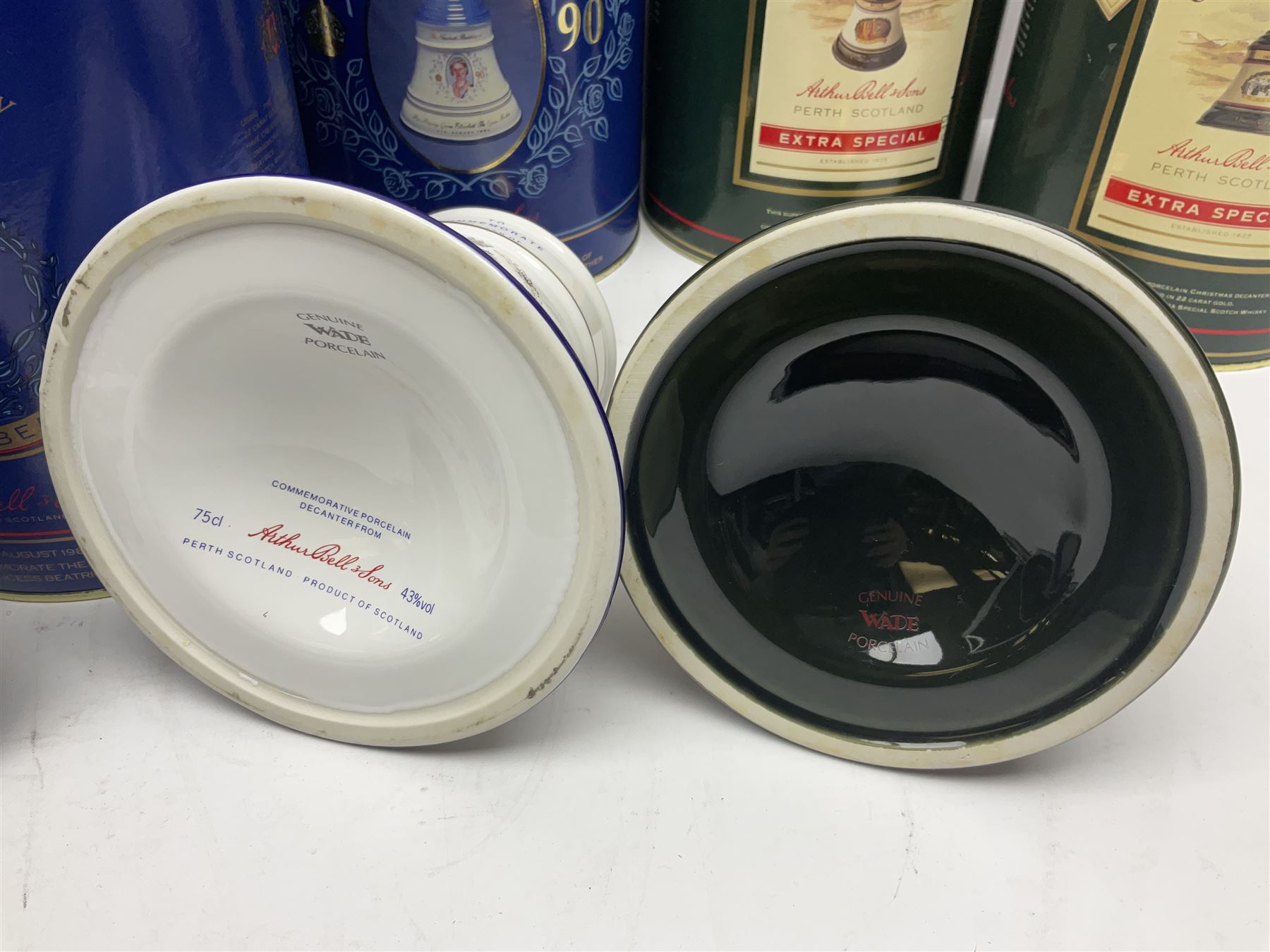 Bells, Scotch whisky, in seven Wade ceramic decanters, including Christmas 1988, 1989, 1990, 1991 etc