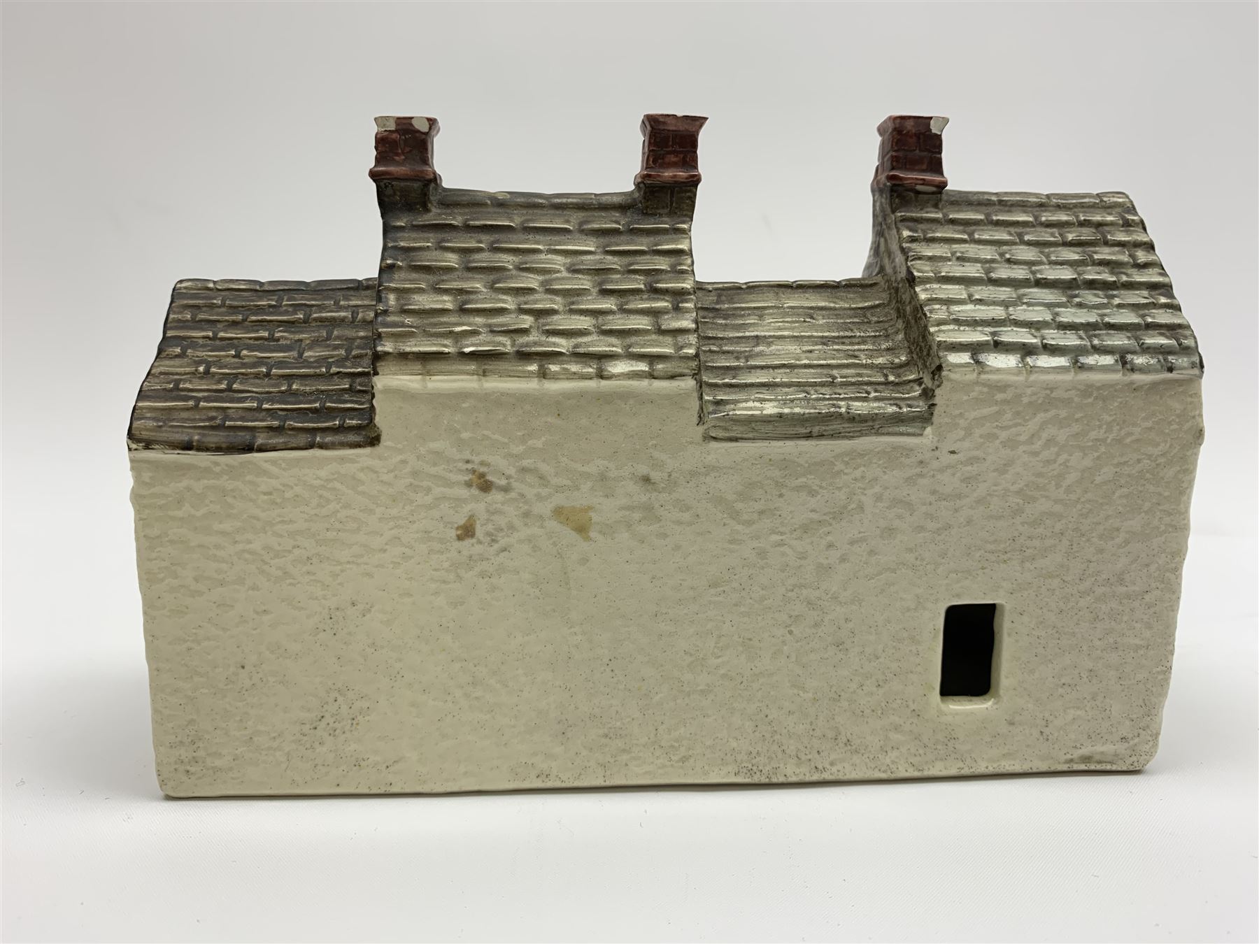 Leeds Pottery pastille burner modelled as two terrace cottages, with impressed mark beneath, H12cm L19cm