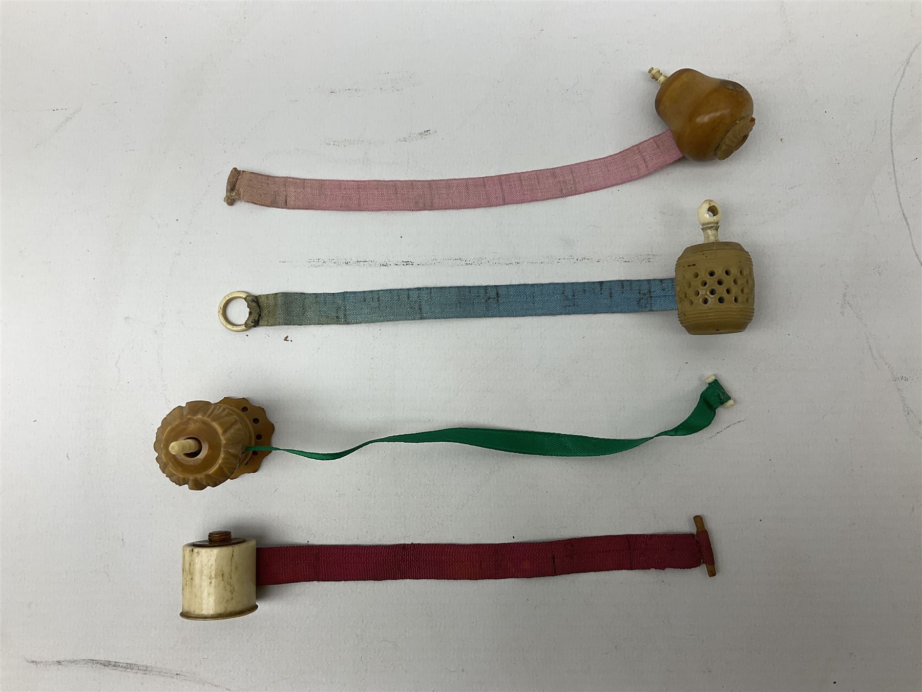 19th century bone and vegetable ivory sewing items including needles cases, pin cushions, thimble cases etc