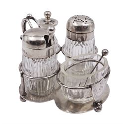 Late Victorian silver mounted four piece cut glass cruet set on stand, comprising pepper shaker, open salt, mustard pot and vinegar bottle, the silver stand with shield engraved with the Workman family crest, hallmarked Hukin & Heath, London 1899, including bottles H7cm