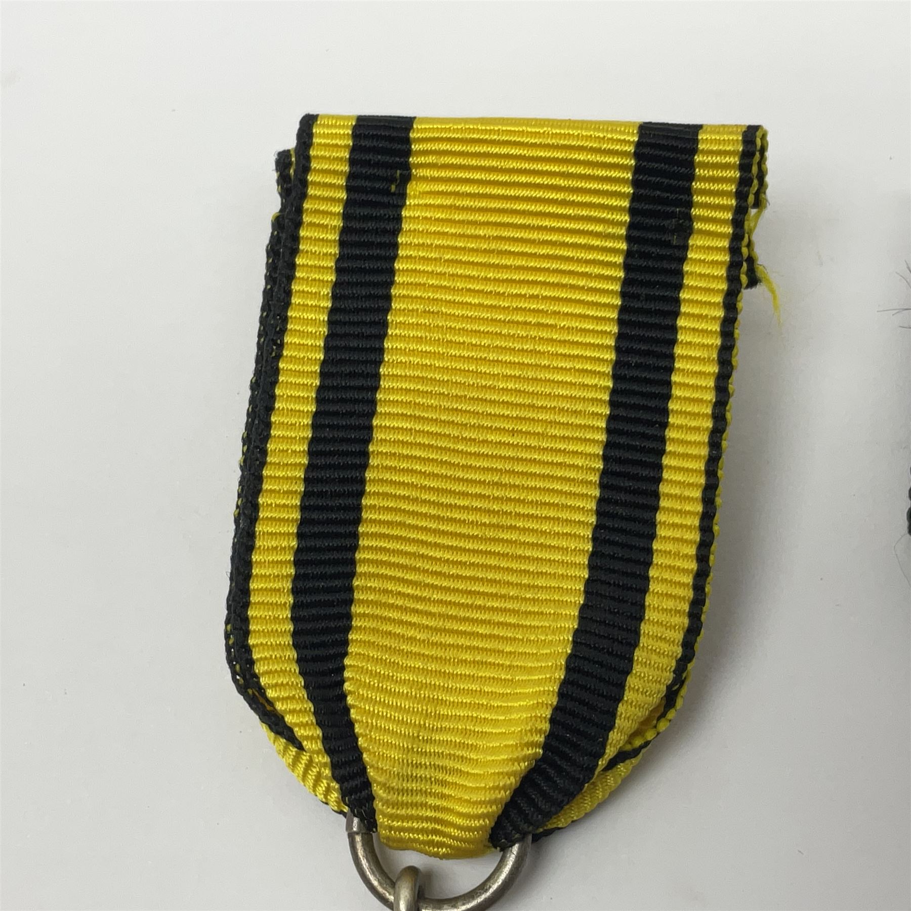 WWII German Iron Cross 2nd Class with ribbon; WWI German Wuerttemberg Medal with ribbon; and Day Badge for 1934 marked Reichsverband Pforzheim32 (3)