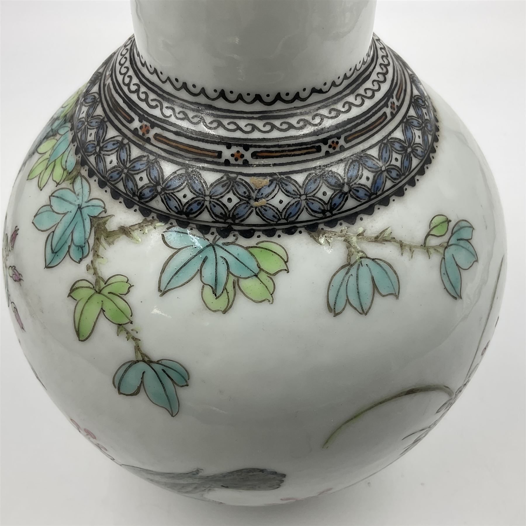 Pair of Chinese Republic porcelain vases, each painted in Famille Rose enamels with pairs of pigeons amidst peony, rock, flowering plants and leafy branches, possibly Qianlong seal beneath, H22cm 