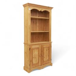 Contemporary pine kitchen dresser, moulded cornice over open plate rack with shaped frieze...