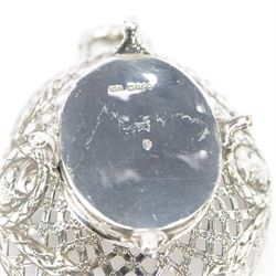 Late 19th/early 20th century German Hanau silver basket, modelled in George II style, of shaped openwork lattice form with twin handles, the body decorated with two portrait roundels and husk and ribbon swags, upon four scroll feet, with unattributed pseudo Hanau marks, and hallmarked John George Piddington, London import 1901, including handles H7cm W15cm
