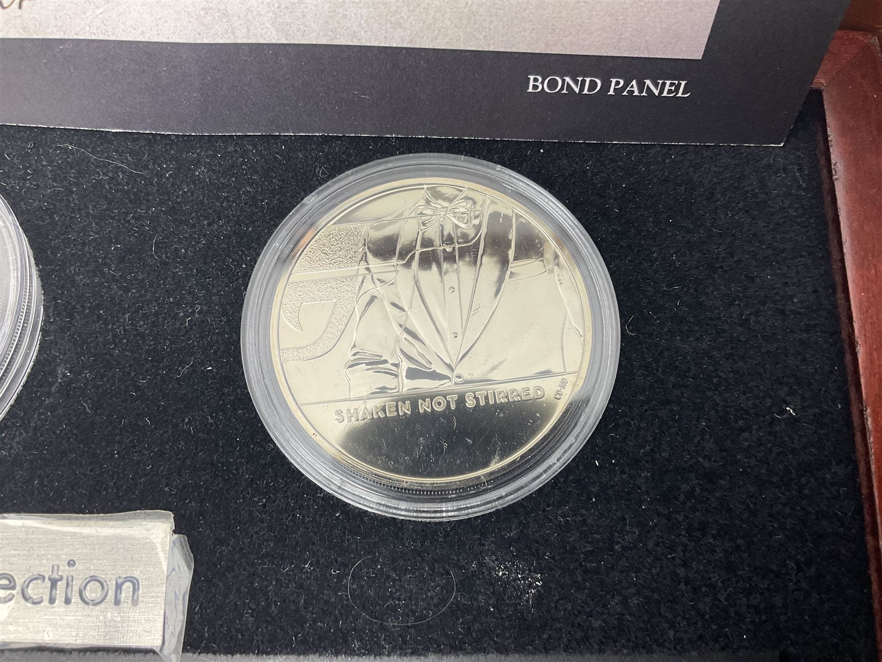 Danbury Mint 'The Ultimate James Bond Collection' comprising stamps and coins housed in a display case, 'Concorde Queen of the Skies' sculpture, stamps, medallion display and 2020 'Centenary of the Unknown Warrior' five pound coin cover in Harrington and Byrne folder