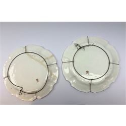 A pair of Italian faience pottery plates, by Giovanni Battista Viero, each of circular form with piecrust rim, with painted floral decoration, each with painted mark beneath, (a/f), D37.5cm