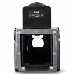 Hasselblad 500C medium format camera, serial no. TC60836, circa 1965, with Carl Zeiss Planar 1:2.8 f=80mm lens with cap, serial no. 4199654, one film back, serial no. TC87300 and a Hasselblad PM5 prism viewfinder serial no. 401EE1335