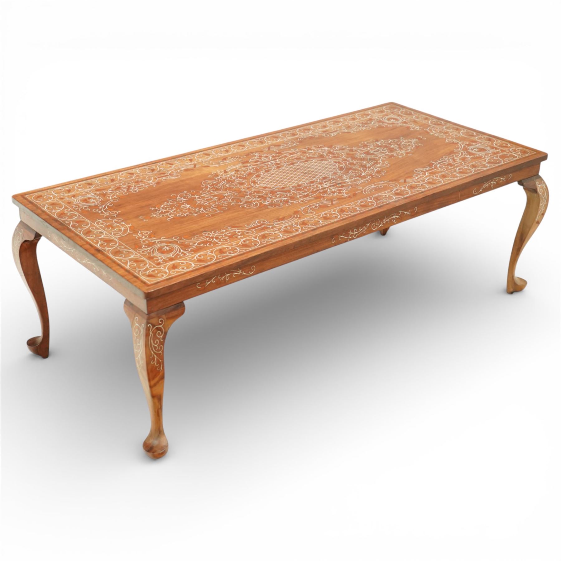 20th century Indian style bone inlaid coffee table, rectangular top profusely inlaid with scrolling foliate decoration centred by an oval medallion, matching inlay to the frieze and cabriole legs, raised on shaped feet