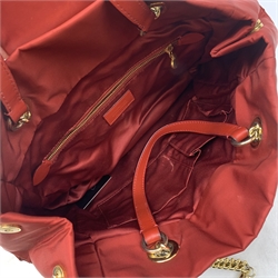 A Moschino red quilted handbag, with gold coloured hardware, L37cm. 