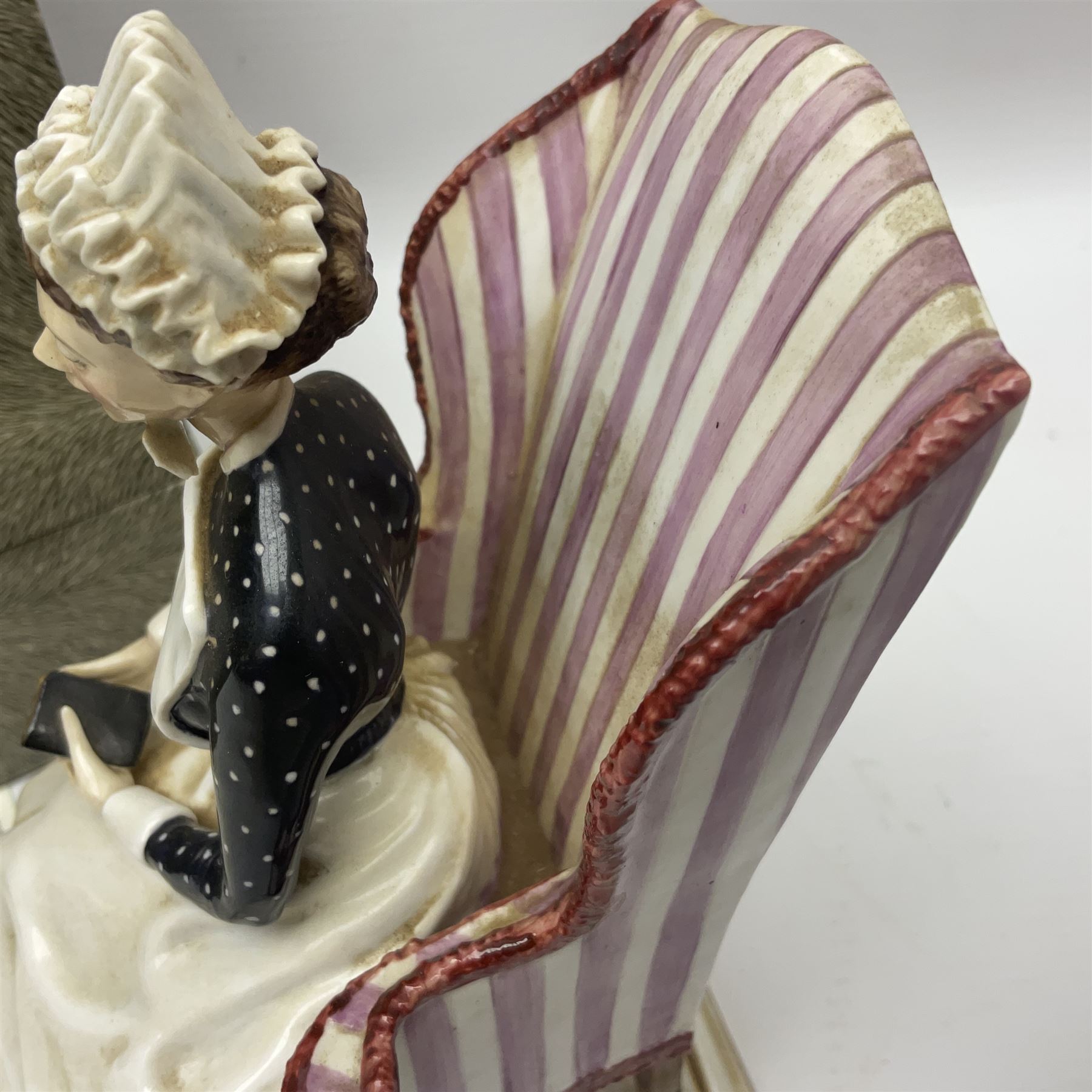 Royal Worcester limited edition figure, Sister St Thomas Hospital (London), no 180/500, modelled as a nurse in uniform, sitting on a striped wingback chair, with printed mark beneath, in original box with certificate, H16cm