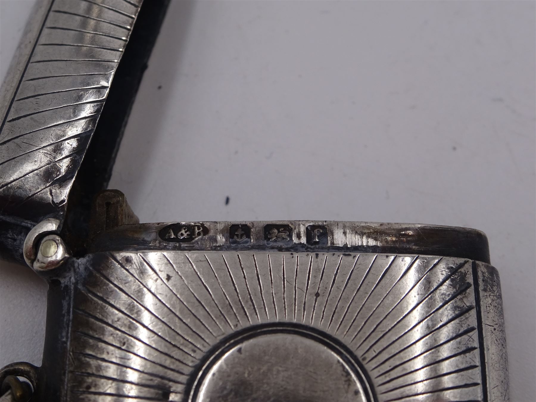 Five Victorian and later silver vesta cases, including Edwardian example with engraved sunburst decoration, hallmarked Abrahall & Bint, Birmingham 1905, and an early 20th century example with engraved foliate decoration and pull-out match compartment, hallmarked Sydney & Co, Birmingham 1910