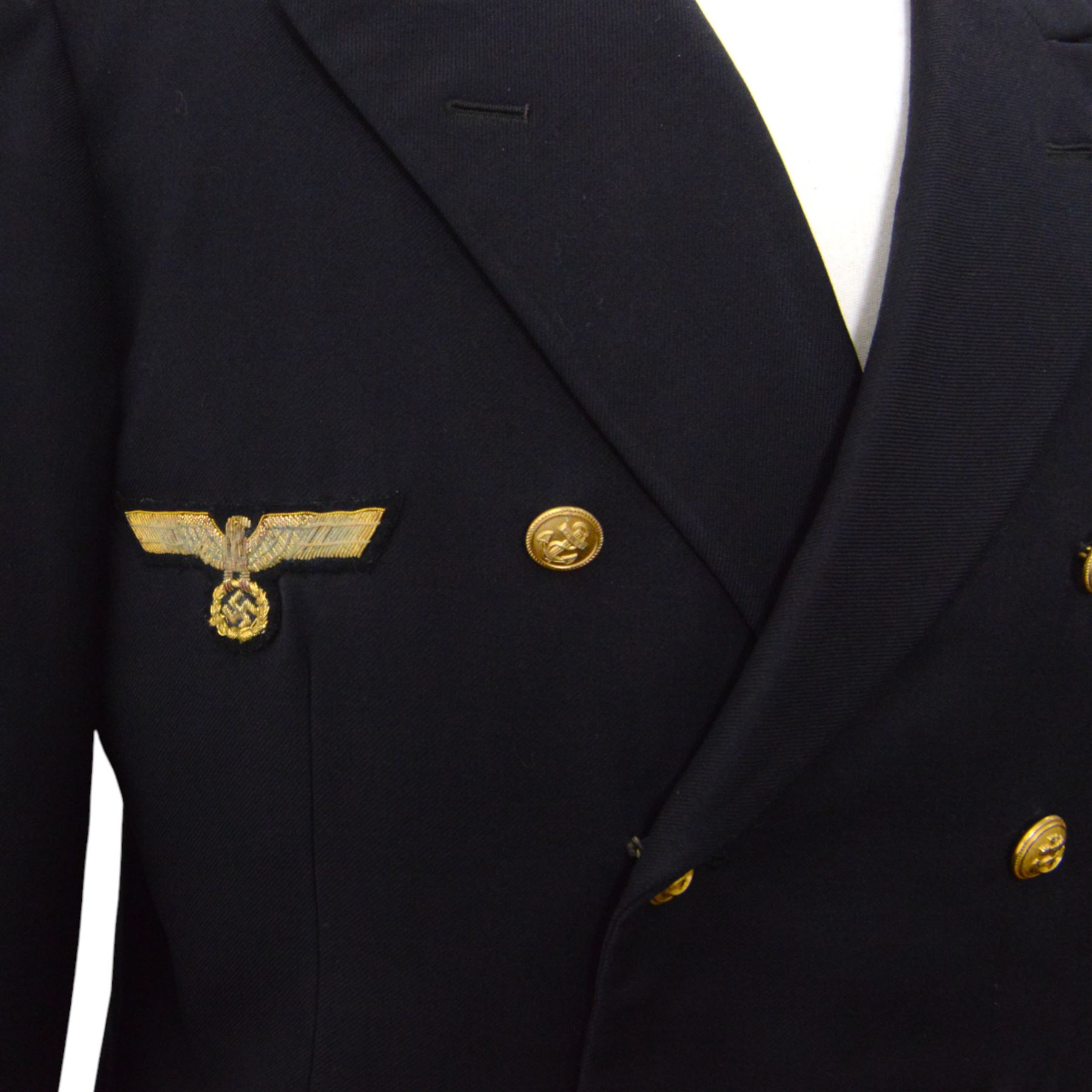 German World War II Kreigsmarine navy blue jacket by Ernst Brendler, Hamburg, with ribbon band, National Emblem and  anchor brass buttons
