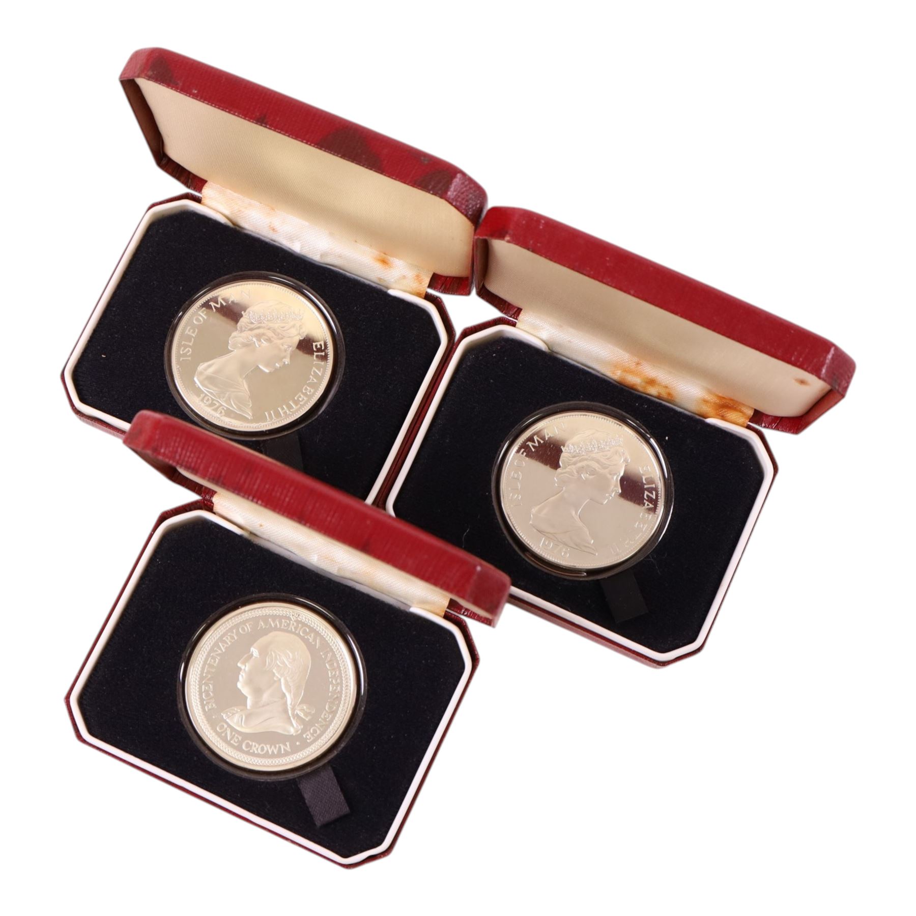 Seven silver proof coins, comprising five Queen Elizabeth II Isle of Man 1976 'Bicentenary of American Independence' crowns, Tokelau 1979 dollar, and New Zealand 1977 dollar, and a John Pinches 'Edward Duke of Windsor' silver medallion, all cased