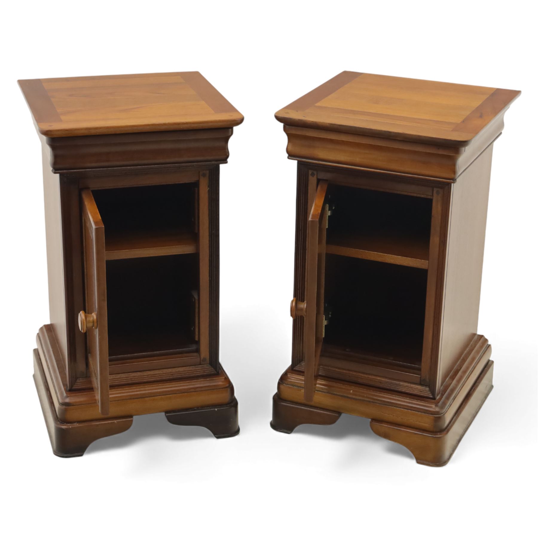 Willis & Gambier - French cherry wood bedside cabinets, each with square moulded top, frieze baize lined drawer and single cupboard door, raised on shaped plinth bases