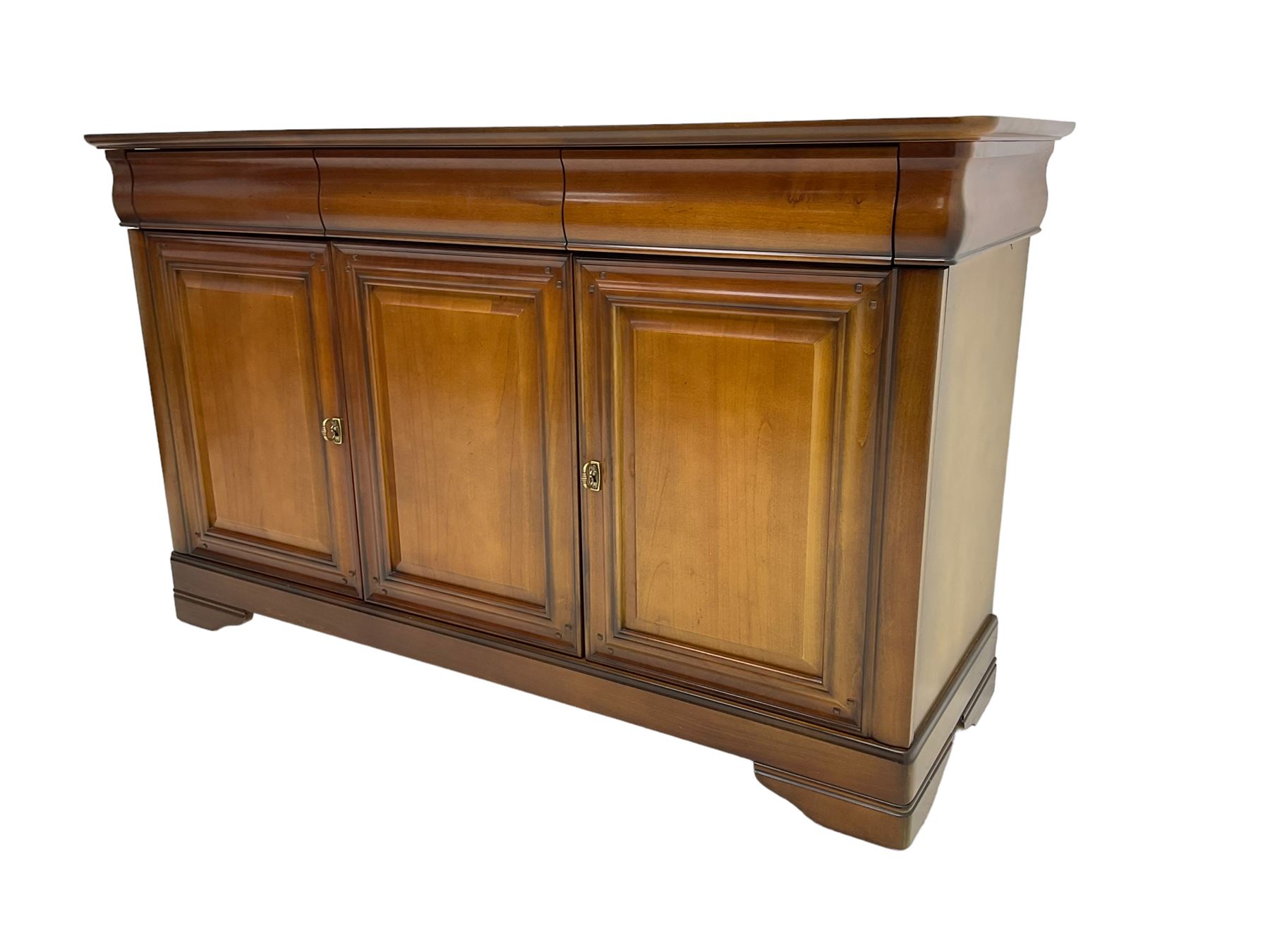 Cherry wood sideboard, fitted with three cushion drawers over three panelled cupboard doors, on bracket feet