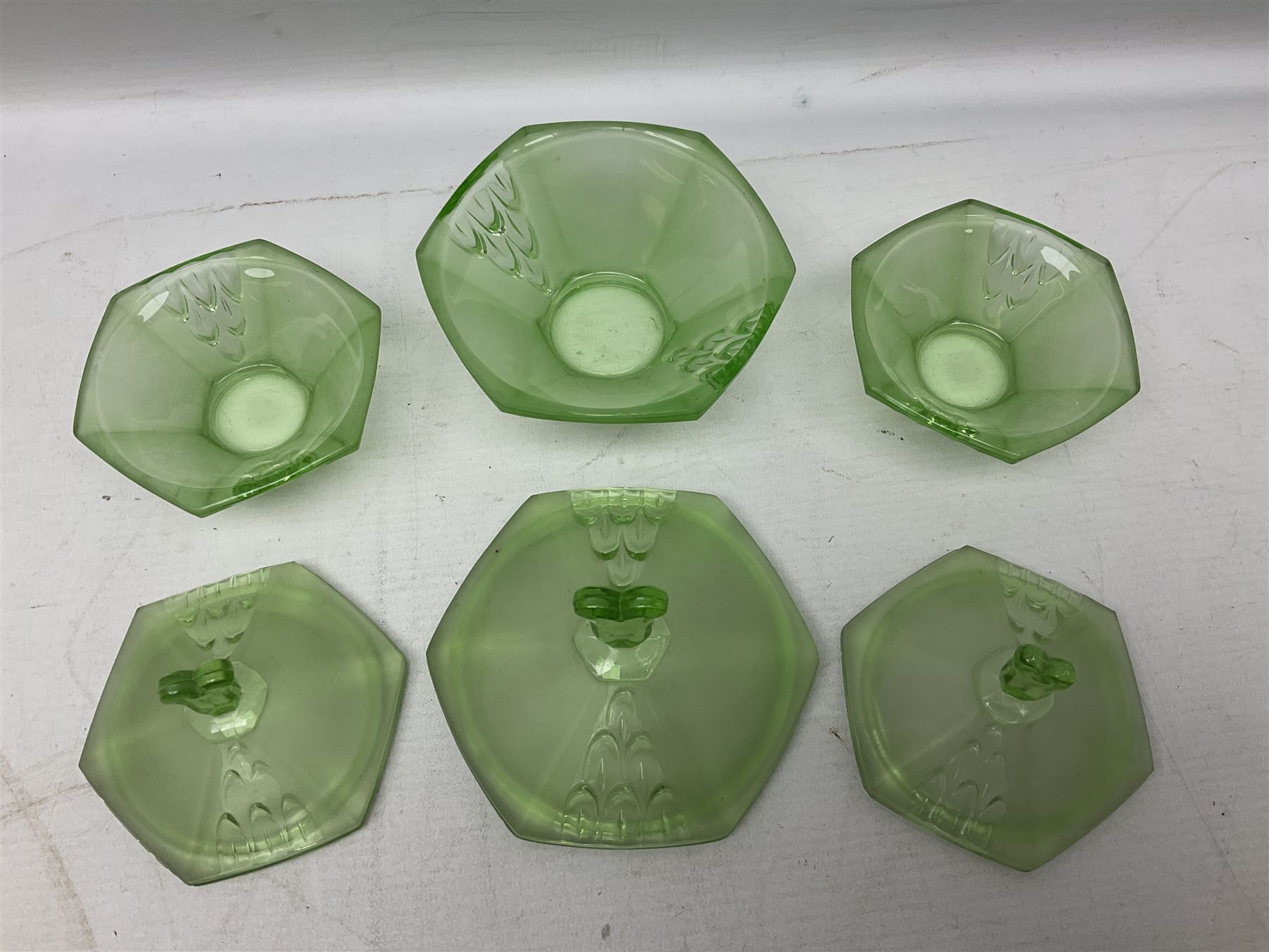 Czech uranium glass dressing table set, comprising twin handled tray, pair of candlesticks, three lidded jars and ring holder dish, and a blue Finnish Riihimäki glass, tray L35cm