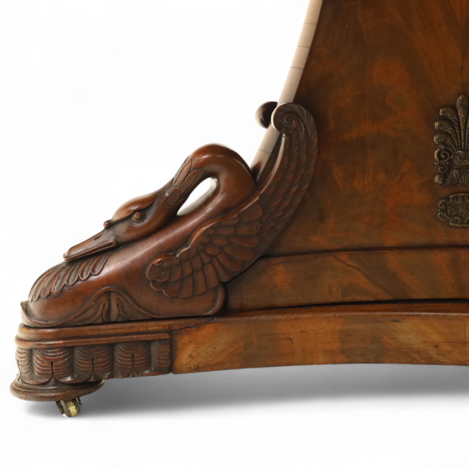 French mid-19th-century Second-Empire mahogany centre table with a dished grey-veined marble top, on a tapered triform pedestal with anthemion brass mounts above carved recumbent swan figures with delicately refined wings and graceful necks curving backwards, associated with the Empress Josephine, raised on three small platform bases