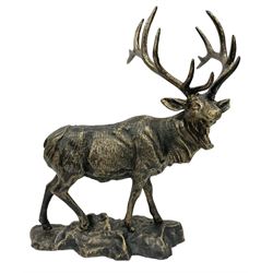 Bronzed cast metal figure of a stag upon a naturalistic base, H44cm
