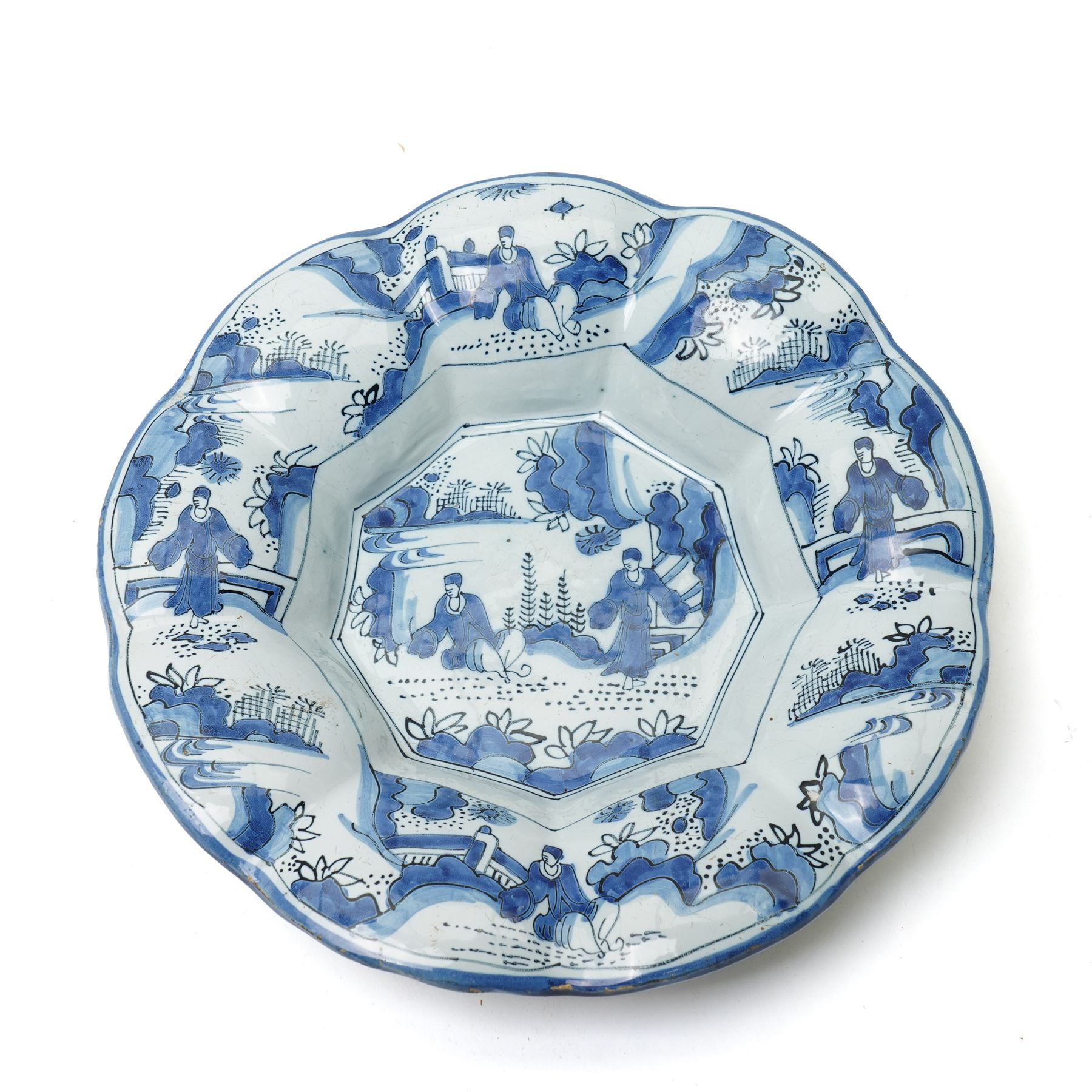 Early 18th century Frankfurt tin glazed earthenware shallow dish decorated in blue with panels of Chinese figures and landscapes D34cm