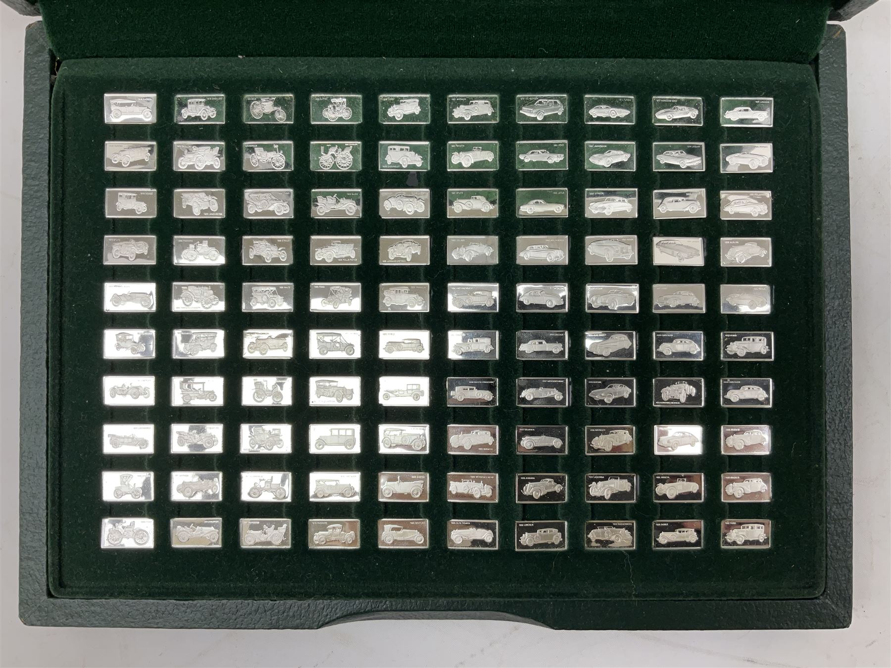 '100 Greatest Cars', set of one hundred silver miniature car ingots by John Pinchers, in presentation box 