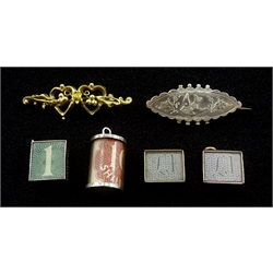 Two gold money box charms, gold brooch all 9ct, silver brooch and two silver charms, all stamped or hallmarked 