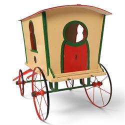G & J Lines wooden gypsy caravan model, painted in cream with red roof, wheels and green detailing, H51cm, L89cm