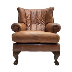 Tetrad - 'Blake' club armchair, fanned wingback and rolled arms upholstered in tan brown leather, on ball and claw carved cabriole feet 