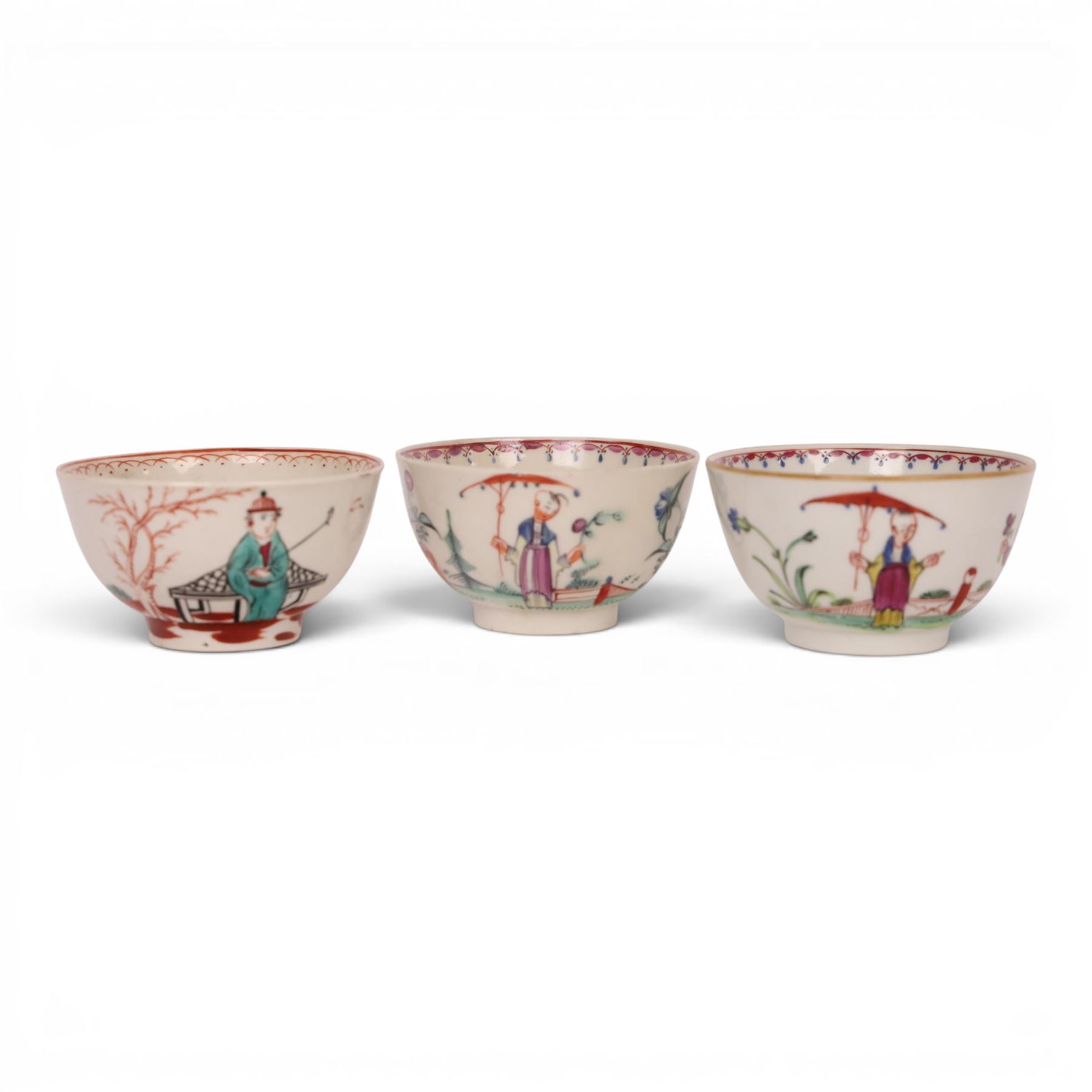 18th/ 19th century chinoiserie decorated porcelain including two New Hall tea bowls and a coffee cup in Boy and the Windmill pattern, Worcester Mandarin coffee cup and Liverpool tea bowl 
