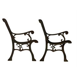 Pair cast iron garden bench ends decorated with scrolling design (H83cm), another pair of cast iron bench ends (H78cm), and a cast iron bench back decorated with foliage branches and roses (W110cm x H30cm)