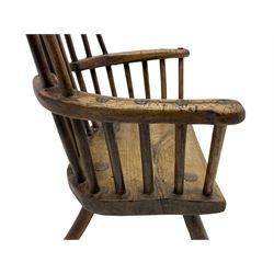18th century primitive elm child's Windsor, comb back with plain cresting rail, curved arms with visible joins, splayed supports with front stretcher, with evidence of green and black paint mainly to the underneath 