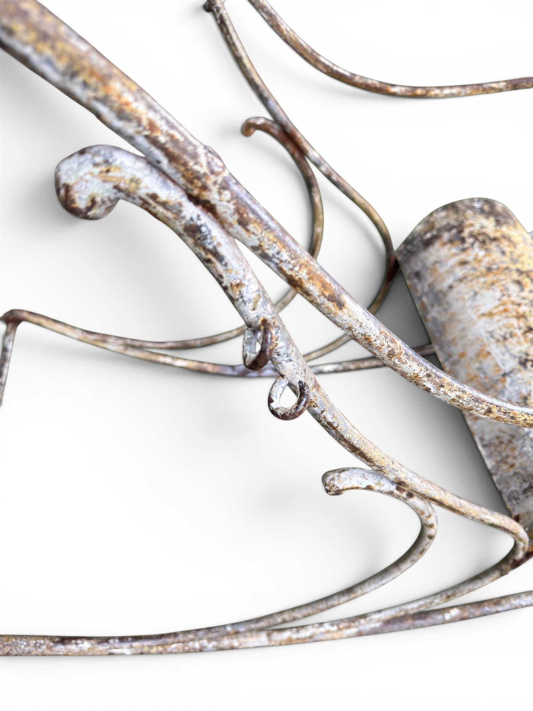 Pair of large unusual 19th century wrought iron garden rocking chairs, simple scroll design, lacking canvas seat