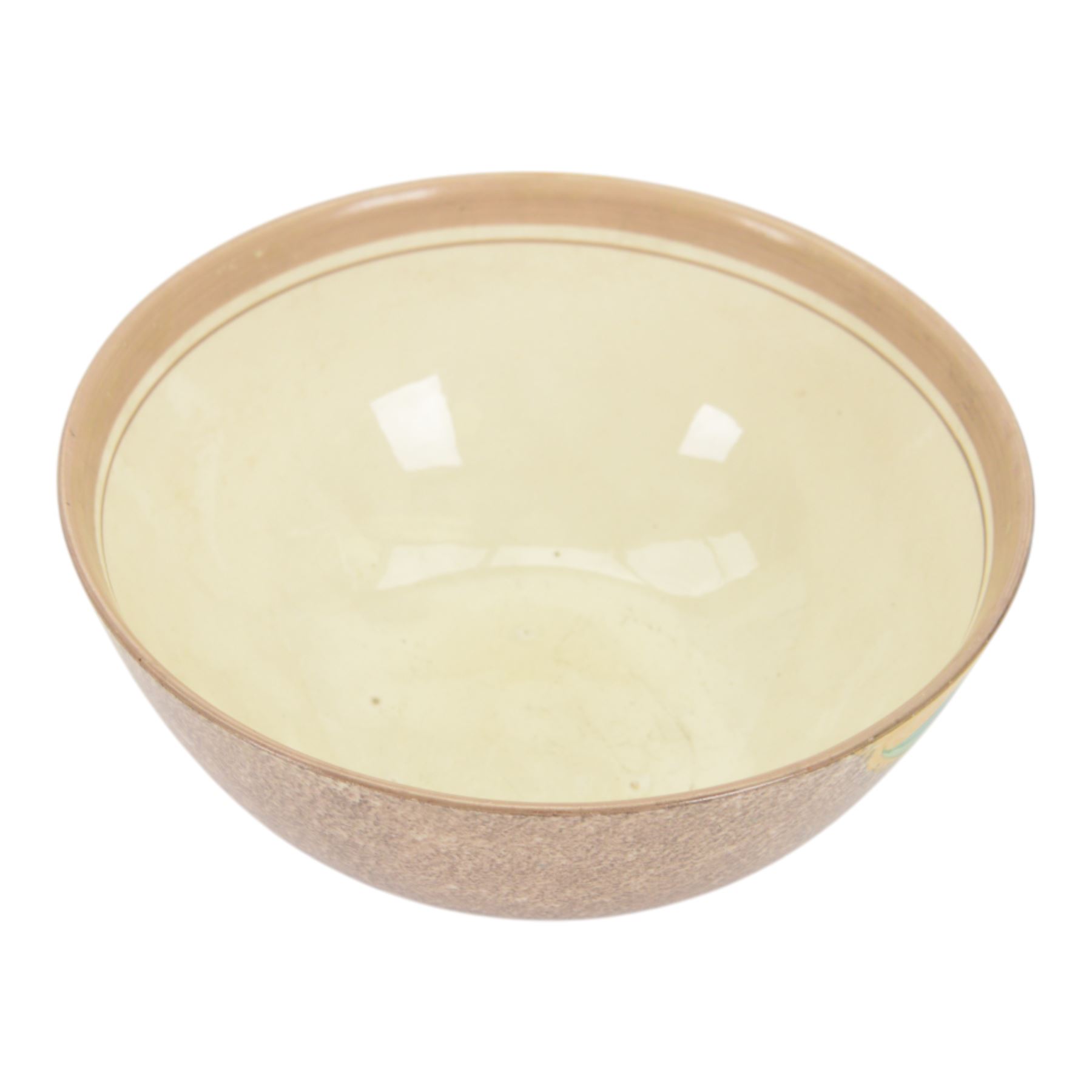 1930s Clarice Cliff Bizarre for Newport Pottery bowl, decorated in the Canterbury Bells pattern, the exterior painted with stylised flowers in blue, yellow and orange amongst foliage upon a brown and yellow Cafe au Lait stippled ground, with black printed mark beneath, D18cm