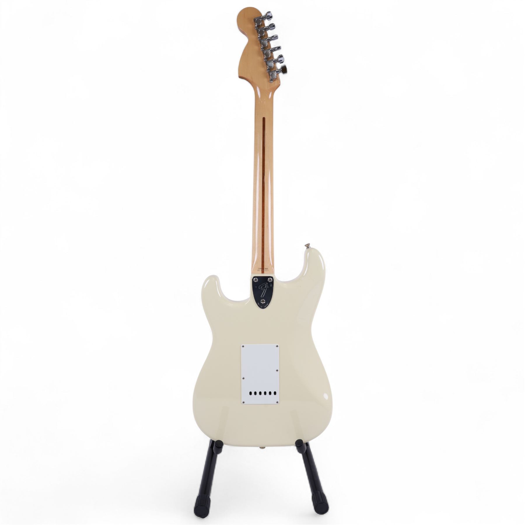 Fender Stratocaster electric guitar, serial no. P093223 made in Japan c.1993, with cream body, white scratch plate, maple neck, three pickups, three control dials and five way selector switch, in a black Fender USA hardcase, guitar L99cm
