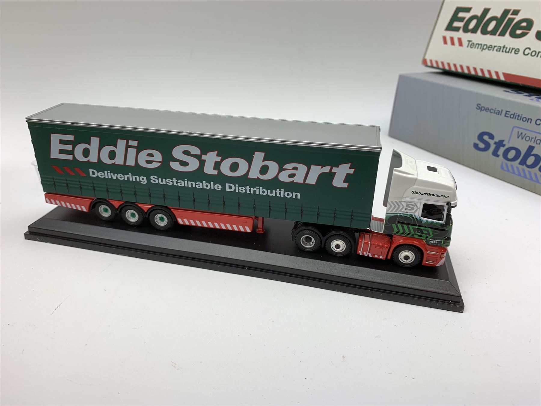 Four Atlas Editions 1:76 scale Special Edition Collector's Models of Eddie Stobart vehicles with paperwork; and another by Corgi No.59516; all mint and boxed; together with an Eddie Stobart DVD (6)