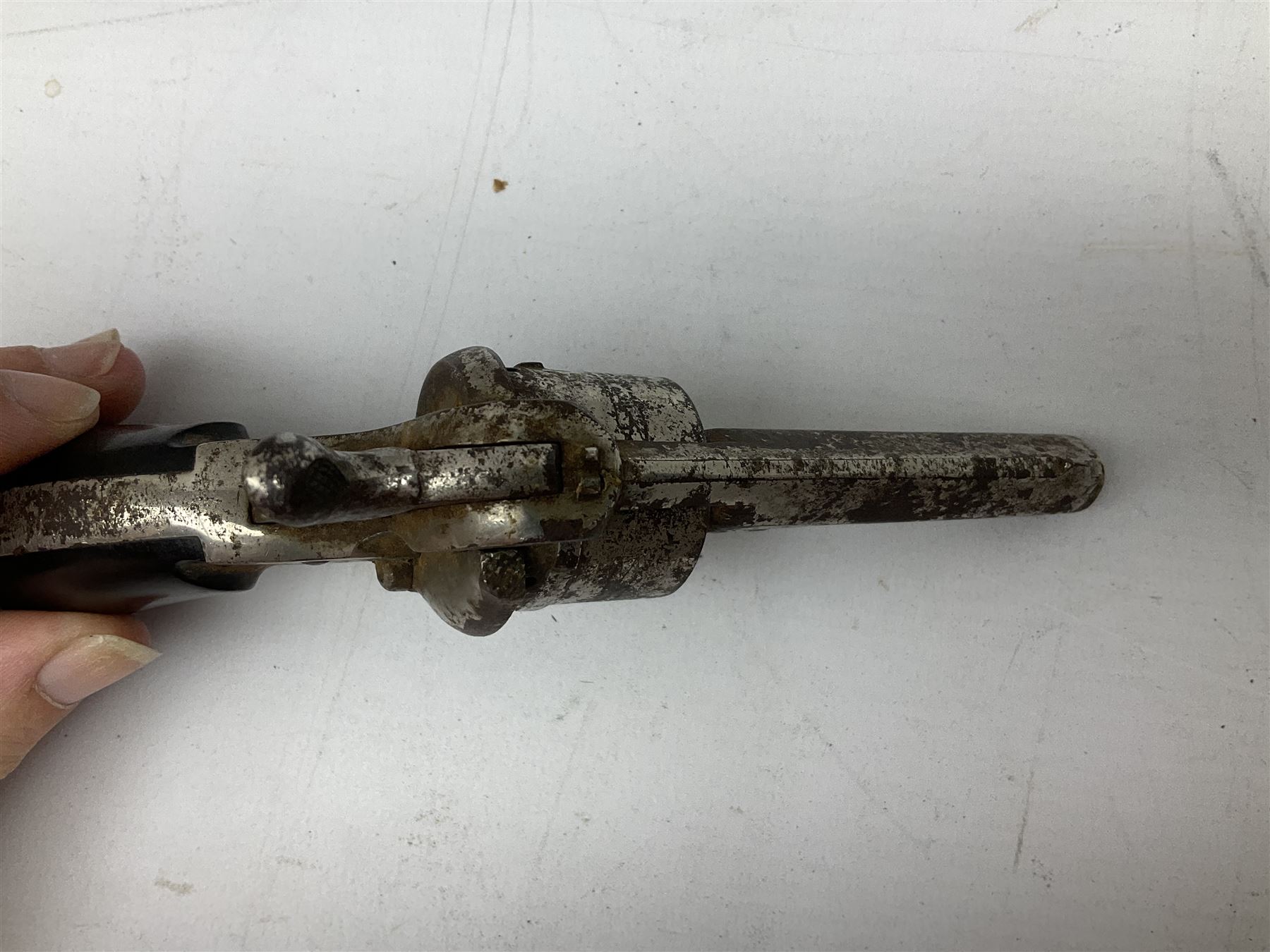 19th century 7mm six-shot pin-fire revolver, with folding trigger, two-piece ebonised grip and ejector rod in butt L17cm