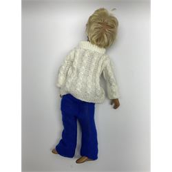 Sasha Morgenthaler 'Gregor' vinyl doll, the boy's head with painted blue eyes and lips and blonde hair, the jointed body donning a white turtleneck knitted jumper and blue knitted trousers, unmarked, H41cm