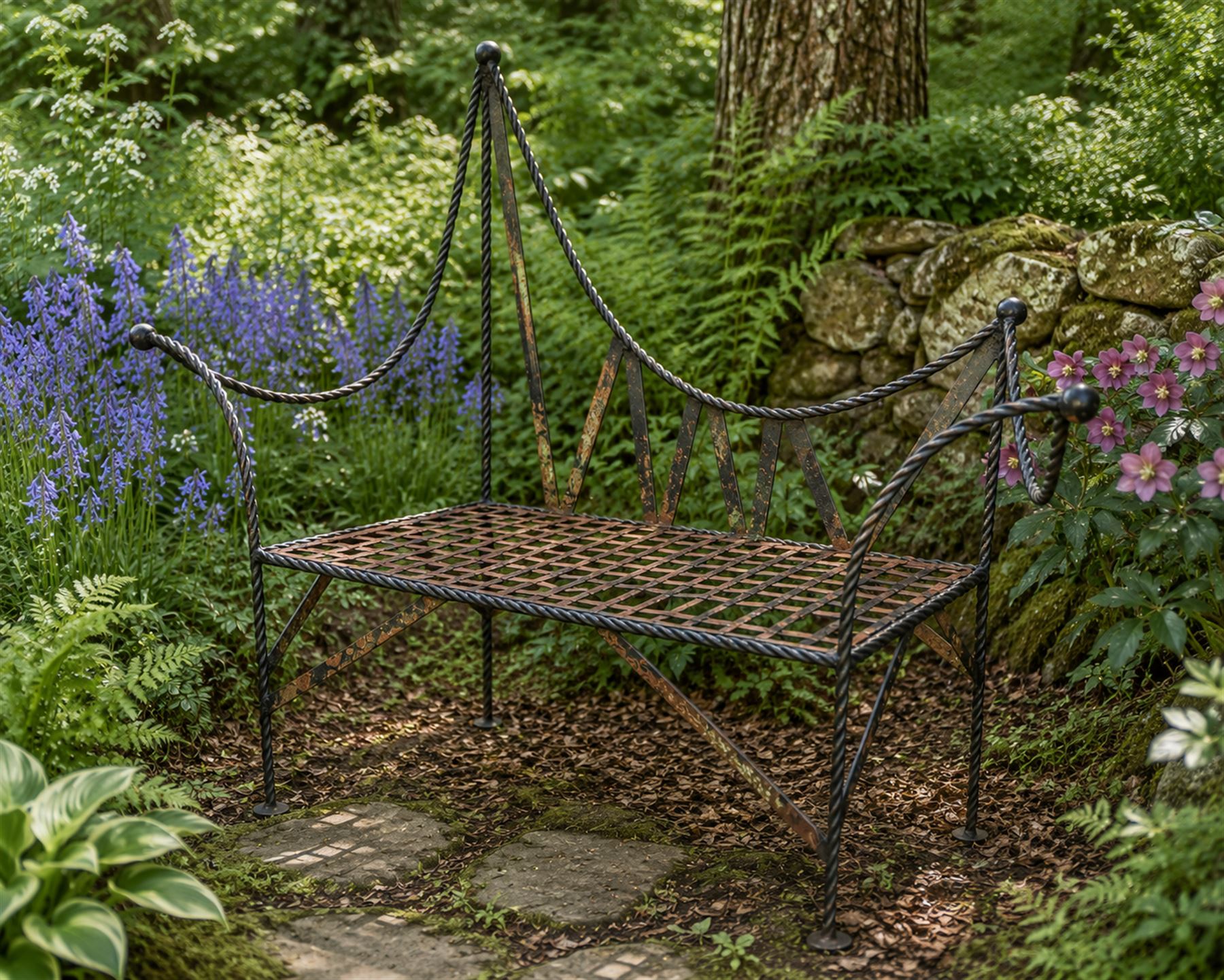 Victorian design wrought iron garden bench, with asymmetrical rope-twist frame, arched back and sides over out-swept arm terminals with ball finials, flanking a lattice seat, in antique black-painted weathered finish